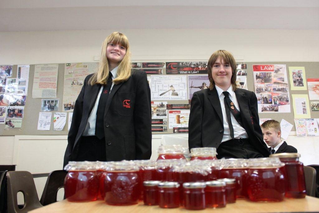 Year 10 students from the Young producers' Co-operative with jars of crab apple jelly